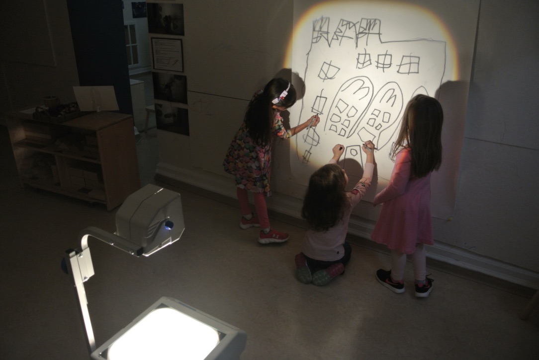 Children drawing on the wall