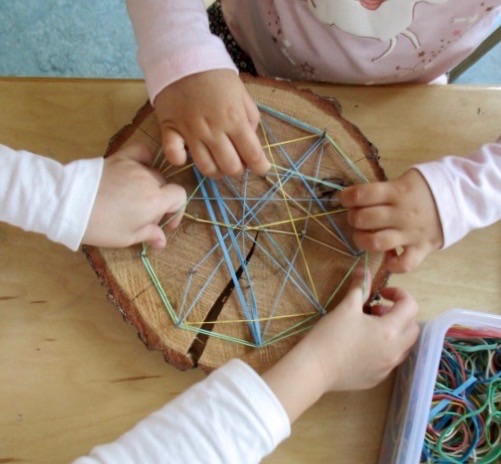 children wrapping string around nails